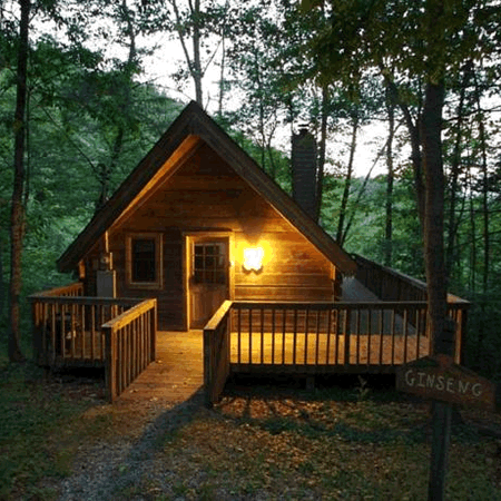 Picture of a cabin with a wrap around deck.